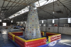 Adult N children climbing wall