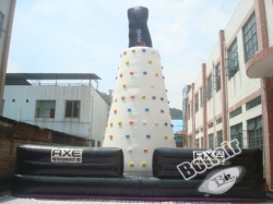 Kids play inflatable rock climbing wall